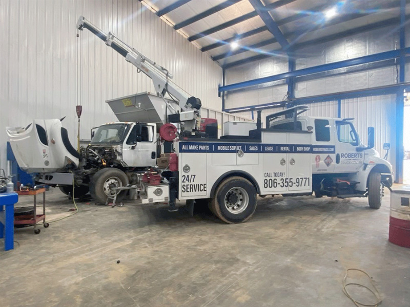 Our service truck with the crane deployed at a customer's shop.